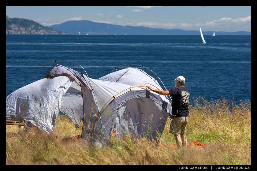 Camper pitches a North Face tent at Ruckle Park, Salt Spring Island